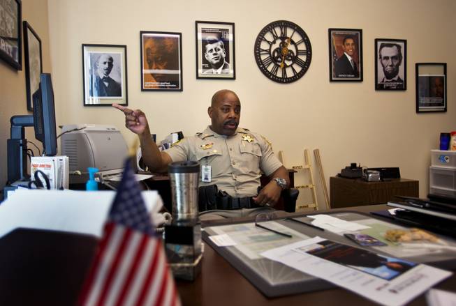 Capt. Will Scott of the Las Vegas Metro Police Department is in charge of the Bolden Area Command, a local neighborhood with some community challenges on Thursday, June 5, 2014. As inspiration he surrounds himself in his office by a diverse selection of great leaders and thinkers from around the globe.