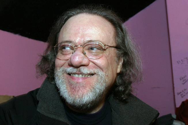 In this Jan. 8, 2005, file photo, Tommy Ramone, ex-drummer and manager of the Ramones, smiles as he is interviewed backstage at the Knitting Factory in New York. A business associate says Ramone, a co-founder of the seminal punk band and the last surviving member of the original group, died Friday, July 11, 2014. Ramone was 65.