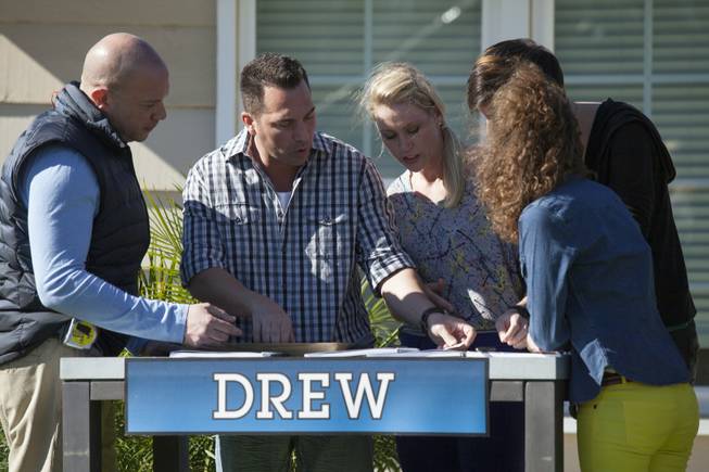 Interior designer Melissa Roche of Las Vegas competes in Season 2 of “Brother vs. Brother” on HGTV. Team Drew members Eric Eremita, Thomas Brown, Roche, Six and Drea Clark work out what they think the value of the Hodge house is in Northridge, Calif. Roche was crowned the champion on the finale Sunday, July 13, 2014.