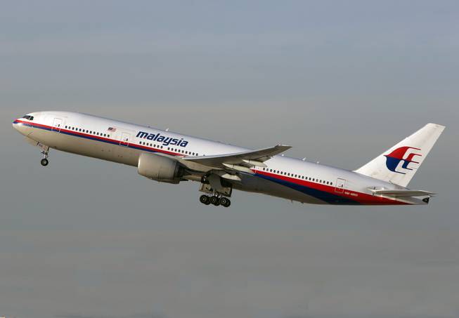 In this Nov. 15, 2012 photo, a Malaysia Airlines Boeing 777-200 takes off from Los Angeles International Airport in Los Angeles. The plane, with the tail number 9M-MRD, is the same aircraft that was heading from Amsterdam to Kuala Lumpur on Thursday, July 17, 2014 when it was shot down near the Ukraine Russia border, according to Anton Gerashenko, an adviser to Ukraine's interior minister.