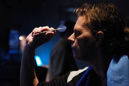 Stacy Bromberg throws during a meeting of the Las Vegas Darts league Wednesday, July 2, 2014, at Crowbar.