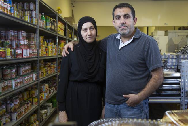 Businessman Abdul Nasser Karouni poses with his wife Mirian at the Afandi Restaurant and Market, 5181 W. Charleston Blvd., Wednesday, July 16, 2014. Mirian was granted citizenship over a year ago but Karouni is still waiting. Karouni owns Alfandi with his business partner Ghazwan "Gino" Salem. STEVE MARCUS