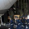 Photo: Ukrainian honor guards march away from a cargo pla Photo: Ukrainian honor guards march away from a cargo pla
