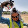 Photo: Construction worker Ruben Roman drips water on his Photo: Construction worker Ruben Roman drips water on his