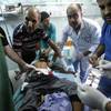 Photo: Palestinian medics treat a child wounded in an Isr Photo: Palestinian medics treat a child wounded in an Isr