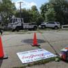 Photo: Police tow a heavily damaged SUV from the scene of Photo: Police tow a heavily damaged SUV from the scene of