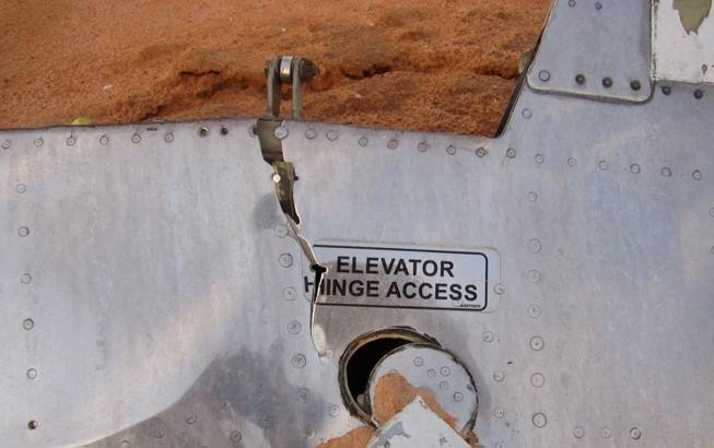 This photo provided on Friday, July 25, 2014, by the Burkina Faso Military shows a part of the plane at the crash site, in Mali. French soldiers secured a black box from the Air Algerie wreckage site in a desolate region of restive northern Mali on Friday, the French president said. Terrorism hasn't been ruled out as a cause, although officials say the most likely reason for the catastrophe that killed all onboard is bad weather. At least 116 people were killed in Thursday's disaster, nearly half of whom were French.