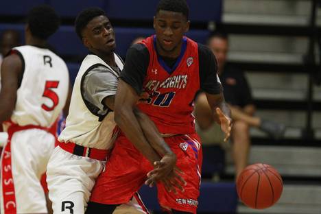 Showtime Ballers Dwayne Bacon knocks the ball out of the hands of New Heights Djabril Diallo during their game at the Las Vegas Fab 48 tournament Friday, July 25, 2014.