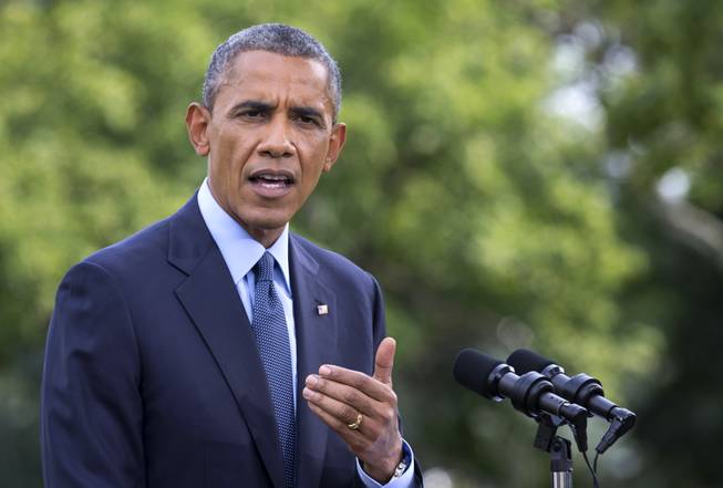 President Barack Obama speaks on the South Lawn of the White House in Washington, Tuesday, July 29, 2014, as he announces new economic sanctions against key sectors of the Russian economy in the latest move by to force Russian President Vladimir Putin to end his support for Ukrainian rebels.
