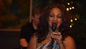 Michelle Johnson sings during the celebration of her 50th birthday at the Dispensary on Lounge on July 19, 2014.