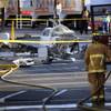 Photo: The wreckage of a small plane sits in the parking Photo: The wreckage of a small plane sits in the parking