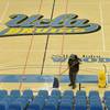 Photo: Cleaning crews work to dry the floor at UCLA's Pau Photo: Cleaning crews work to dry the floor at UCLA's Pau