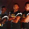Photo: From left, Clark High School football players Mar Photo: From left, Clark High School football players Mar