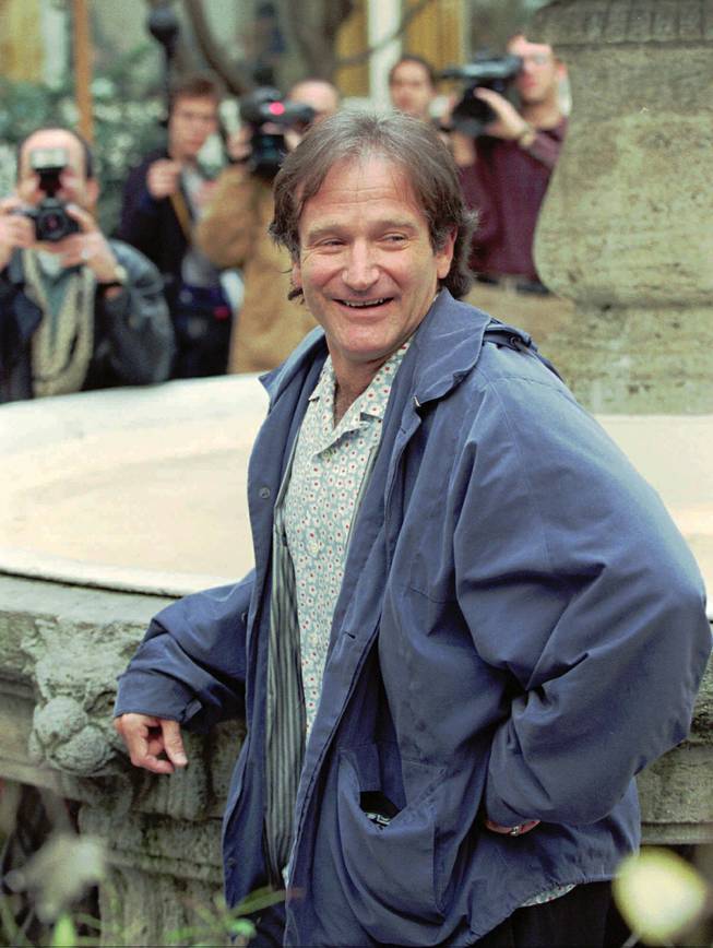Actor-comedian Robin Williams poses for the photographers in the backyard of a hotel in Hamburg, Germany, on Friday, April 19, 1996. Williams, well known for his movies "Mrs. Doubtfire", "Hook", "Dead Poets Society", "Good Morning Vietnam" and more recently "Jumanji", is promoting his new picture "Birdcage."