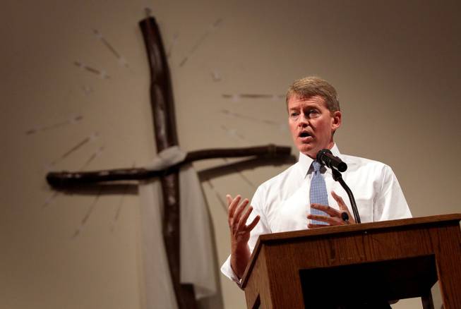 Missouri Attorney General Chris Koster, right, speaks at the Greater St. Mark Family Church in Ferguson, Mo. on Sunday Aug. 17, 2014. "A member of your community died at the hands of a member of my community," Koster said. "Not just the caucasian community but the law enforcement community." On Saturday, Aug. 9, 2014, a white police officer fatally shot Michael Brown, an unarmed black teenager, in the St. Louis suburb.