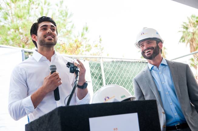 Guiseppe Pizano (left), a former homeless youth and NPHY beneficiary, shares his story of homelessness and how he received assistance through NPHY while Arash Ghafoori, NPHY executive director, listens. Pizano subsequently graduated from high school and is now attending college and working.