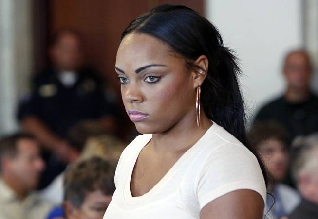 In this July 24, 2013, file photo, Shayanna Jenkins, fiancee of former New England Patriots NFL football player Aaron Hernandez, arrives at a hearing for Hernandez at Attleboro District Court in Attleboro, Mass. Her lawyers filed a motion Thursday, Aug. 14, 2014, in county court in Fall River, Mass., seeking to have perjury charges dismissed.