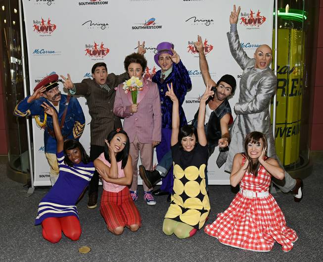 Artists from "The Beatles’ Love" by Cirque du Soleil on Thursday, Aug. 21, 2014, at McCarran International Airport, after arriving on a flight from San Francisco, where they performed in celebration of the 50th anniversary of The Beatles' only Las Vegas appearance. The Beatles took the same route in 1964, when they performed in San Francisco before traveling to Las Vegas.