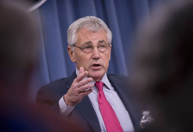 This July 3, 2014 file photo shows Defense Secretary Chuck Hagel speaking at the Pentagon. Hagel said Thursday that US airstrikes have helped Iraqi and Kurdish forces regain their footing in Iraq, but he expects Islamic State militants will regroup and stage a new offensive.