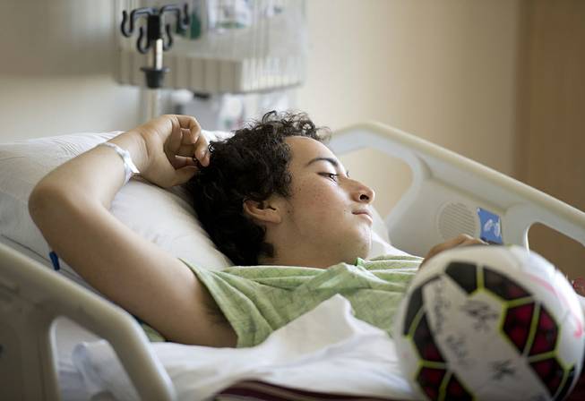Nicholas Dillion rests in his bed at UC Davis Medical Center on Tuesday, Aug. 26, 2014, in Sacramento, Calif., after being injured in Sunday's earthquake. Sunday's quake caused several injuries, left four mobile homes destroyed by gas-fed fires and damaged wineries, historic buildings and hotels in the Napa area.