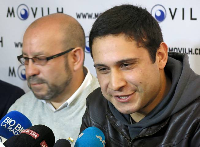 Mauricio Ruiz, 24, sailor of the Chilean Navy, right, comes out publicly as gay during a press conference in Santiago, Chile, Wednesday Aug. 27, 2014. Ruiz who was accompanied by Rolando Jimenez, left, president of the Homosexual Liberation and Integration Movement, is the first member of the Chilean armed forces ever to come out publicly as gay with the approval of the High Command of the Chilean navy.