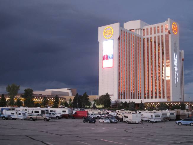 Travelers en route to Burning Man parked more than 100 recreational vehicles at a Wal-Mart and the Grand Sierra Resort Casino in Reno, Nev., Monday, Aug. 25, 2014, when a rare rain storm turned the Black Rock Desert, 90 miles north, into a muddy quagmire. Most were optimistic the access road to the counter-culture festival on an ancient lake bed would reopen on Tuesday.