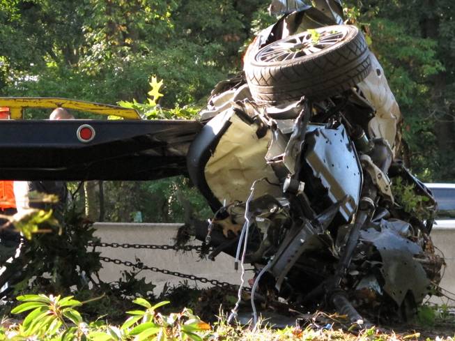 This Oct. 8, 2012 file photo shows the wrecked Subaru Impreza in which four people died as it is loaded onto a flatbed truck on the Southern State Parkway in West Hempstead, N.Y., after and early-morning accident. At the wheel was a New York teenager, Joseph Beer, who had smoked about $20 worth of marijuana, before getting into the car with four friends, and driving over 100 mph before crashing into trees with such force that it split the car in half. As states liberalize their marijuana laws, public officials and safety advocates worry that more drivers high on pot will lead to a spike in traffic deaths. Researchers who have studied the issue, though, are divided over whether toking before taking the wheel in fact leads to more accidents.