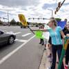 Pamona High School students engage with passing motorists in a busy intersection near their school during a multischool protest against a Jefferson County School Board proposal to emphasize patriotism and downplay civil unrest in the teaching of U.S. history, in Arvada, Colo., Tuesday, Sept. 23, 2014. Students from several high schools walked out of class Tuesday in a second day of protests in Jefferson County. Pamona High School students engage with passing motorists in a busy intersection near their school during a multischool protest against a Jefferson County School Board proposal to emphasize patriotism and downplay civil unrest in the teaching of U.S. history, in Arvada, Colo., Tuesday, Sept. 23, 2014. Students from several high schools walked out of class Tuesday in a second day of protests in Jefferson County.