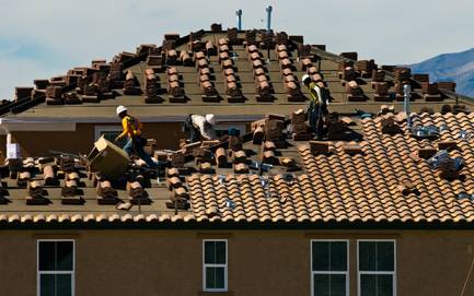 A KB Home roof is tiled during the Super Saturday sales event at the master-planned community of Inspirada on Saturday, Oct. 4, 2014.