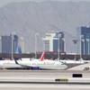 Photo: A Delta plane taxis on the runway at McCarran Inte Photo: A Delta plane taxis on the runway at McCarran Inte
