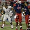 UNLV Rebels defensive lineman Mike Hughes Jr. (99) celebrates after his team defeated the Fresno State Bulldogs in overtime of an NCAA college football game Friday, Oct. 10, 2014, in Las Vegas. The Rebels won 30-27. UNLV Rebels defensive lineman Mike Hughes Jr. (99) celebrates after his team defeated the Fresno State Bulldogs in overtime of an NCAA college football game Friday, Oct. 10, 2014, in Las Vegas. The Rebels won 30-27.