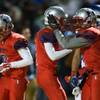 Liberty High School QB Kenyon Oblad #7 celebrates a score with Bryan Roland #3 during the Sunrise Regional championship game on Friday, November 21, 2014. Liberty High School QB Kenyon Oblad #7 celebrates a score with Bryan Roland #3 during the Sunrise Regional championship game on Friday, November 21, 2014.