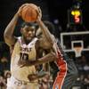 UNLV's Dwayne Morgan, right, fouls Temple's Mark Williams during the first half of a game for third place in the Coaches vs. Cancer Classic on Saturday, Nov. 22, 2014, in New York. UNLV's Dwayne Morgan, right, fouls Temple's Mark Williams during the first half of a game for third place in the Coaches vs. Cancer Classic on Saturday, Nov. 22, 2014, in New York.