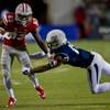 Photo: UNLV wide receiver Devonte Boyd (83) fights off a Photo: UNLV wide receiver Devonte Boyd (83) fights off a