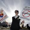 Photo: Cameron Cerf holds a protest sign with Southwest A Photo: Cameron Cerf holds a protest sign with Southwest A