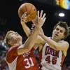 UNLV guard Cody Doolin, right, and Utah center Dallin Bachynski fight for a loose ball at the MGM Grand Garden Arena on Saturday, Dec. 20, 2014. UNLV guard Cody Doolin, right, and Utah center Dallin Bachynski fight for a loose ball at the MGM Grand Garden Arena on Saturday, Dec. 20, 2014.