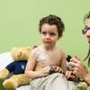 Photo: With mom at his side, Elann Saula, 3, holds back t Photo: With mom at his side, Elann Saula, 3, holds back t