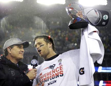 New England QB Tom Brady holds the championship trophy after the AFC title game Sunday, Jan. 18, 2015, in Foxborough, Mass.