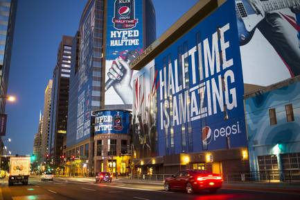 Ads for the Super Bowl are displayed in downtown Phoenix on Thursday, Jan. 22, 2015. The Super Bowl between the Seattle Seahawks and the New England Patriots is to be played Feb. 1, 2015, in Glendale, Ariz.