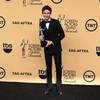 Photo: Eddie Redmayne stands in the press room with the a Photo: Eddie Redmayne stands in the press room with the a