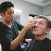 Photo: Kazu Tsuji works on the makeup for Bob Anderson, w Photo: Kazu Tsuji works on the makeup for Bob Anderson, w