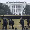 Photo: Secret Service officers search the south grounds o Photo: Secret Service officers search the south grounds o