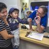 Photo: Pediatrician Charles Goodman, talks with patient C Photo: Pediatrician Charles Goodman, talks with patient C