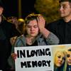 Photo: Kristal Meyers wipes a tear as she stands next to Photo: Kristal Meyers wipes a tear as she stands next to
