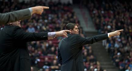 UNLV basketball team head coach Dave Rice and others direct players as they take on Boise State on Wednesday, Feb. 18, 2015.