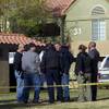 Photo: Investigators confer in a common area near the sce Photo: Investigators confer in a common area near the sce