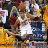 Wyoming's Larry Nance Jr. (22) is passed by Fresno State's Cezar Guerrero, center, in the second half of an NCAA college basketball game in Fresno, Calif., Saturday, Jan. 17, 2015. Wyoming's Larry Nance Jr. (22) is passed by Fresno State's Cezar Guerrero, center, in the second half of an NCAA college basketball game in Fresno, Calif., Saturday, Jan. 17, 2015.