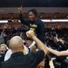 Photo: Clark basketball players celebrate their win over Photo: Clark basketball players celebrate their win over