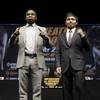 Boxers Floyd Mayweather Jr. and Manny Pacquiao attend a news conference Wednesday, March 11, 2015, in Los Angeles. The two are scheduled to fight in Las Vegas on May 2. Boxers Floyd Mayweather Jr. and Manny Pacquiao attend a news conference Wednesday, March 11, 2015, in Los Angeles. The two are scheduled to fight in Las Vegas on May 2.