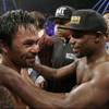 Photo: Manny Pacquiao, left, and Floyd Mayweather Jr. emb Photo: Manny Pacquiao, left, and Floyd Mayweather Jr. emb